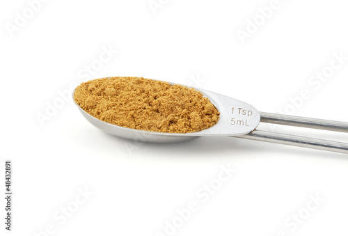 Photo: Ground cumin measured in a metal teaspoon Ground cumin measured in a metal teaspoon