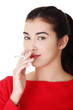 Young woman smoking electronic cigarette