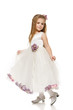 6 years old girl in princess dress making curtsy