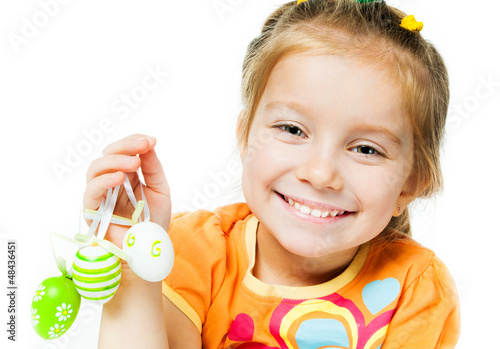 Photo: Happy little girl with easter eggs. Happy little girl with easter eggs.
