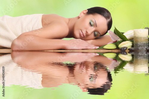 Photo: young healthy girl relaxing in spa young healthy girl relaxing in spa