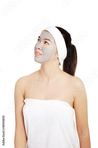 Photo: Beautiful woman with clay facial mask Beautiful woman with clay facial mask