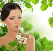 Beautiful young woman with spring blossom