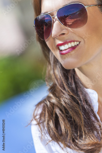 Photo: Happy Woman Wearing Aviator Sunglasses Happy Woman Wearing Aviator Sunglasses