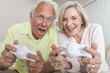 Senior Man & Woman Couple Playing Video Console Game