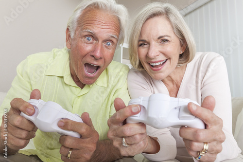 Photo: Senior Man & Woman Couple Playing Video Console Game Senior Man & Woman Couple Playing Video Console Game