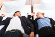 Young couple lying on bed in hotel room