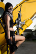 Photo: beautiful girl with weapon and mask beautiful girl with weapon and mask