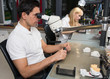 Dental technician polishing gold tooth