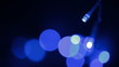 Blue LED lights garland sways in the wind