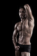 muscled man on a black background