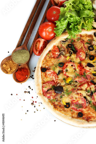 Photo: delicious pizza, vegetables and spices isolated on white delicious pizza, vegetables and spices isolated on white