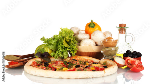 Photo: delicious pizza, vegetables, spices and oil isolated on white delicious pizza, vegetables, spices and oil isolated on white