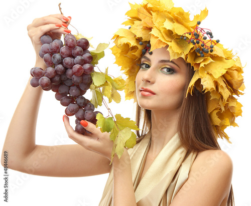 Photo: beautiful young woman with yellow autumn wreath and grapes, beautiful young woman with yellow autumn wreath and grapes,