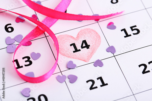 Photo: Notes on the calendar (valentines day), close-up Notes on the calendar (valentines day), close-up