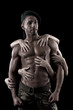 muscled man on a black background