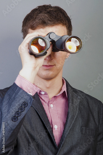 Photo: Businessmen looking through binocular Businessmen looking through binocular