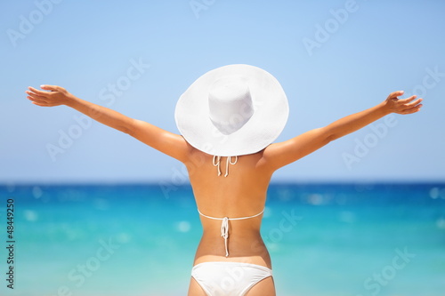 Photo: Beach summer holidays happy freedom woman Beach summer holidays happy freedom woman