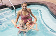 Photo: Family playing in the Swimming Pool Family playing in the Swimming Pool