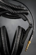 Modern headphones over black background