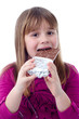 Child girl eating chocolate