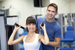 Photo: Young couple in a gym Young couple in a gym
