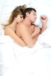 Beautiful pair lays in a bed