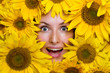 Portrait of a young woman with sunflowers