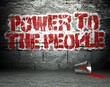 Graffiti wall with power to the people, street background