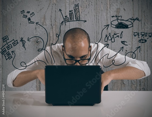 Photo: Businessman working with laptop Businessman working with laptop
