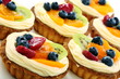 Cream cakes and fruit.