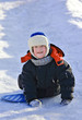 Foto: Kid riding a frozen hill Kid riding a frozen hill