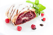 berry pie with cherries and cranberries on a white dish