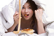 beautiful girl eating under cover
