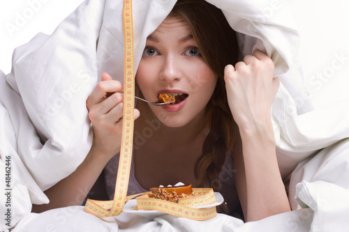 Photo: beautiful girl eating under cover beautiful girl eating under cover