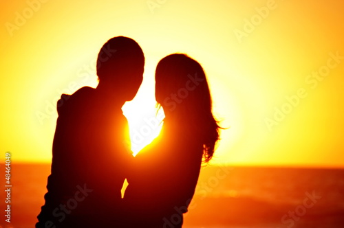 Photo: loving couple beach sunset loving couple beach sunset