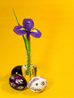 Photo: Three painted easter eggs and iris flower Three painted easter eggs and iris flower
