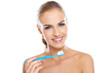 Beautiful woman with a toothbrush and paste