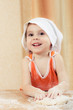Pretty beautiful girl at the table making pies.