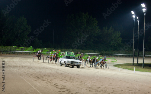 Photo: Training trotters race in hippodrome Training trotters race in hippodrome