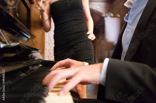 Photo: Man playing piano Man playing piano