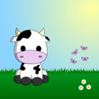 Cute cow sitting in grass