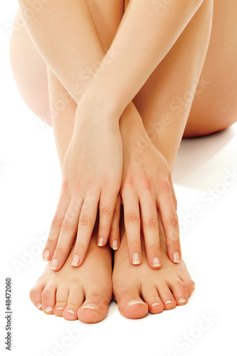Photo: Beautiful woman's crossed legs and hands Beautiful woman's crossed legs and hands