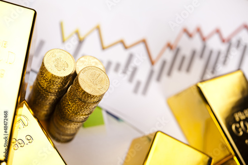Photo: Gold bars with a linear graph Gold bars with a linear graph