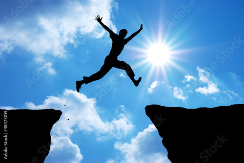 Photo: Man jump through the gap. Man jump through the gap.