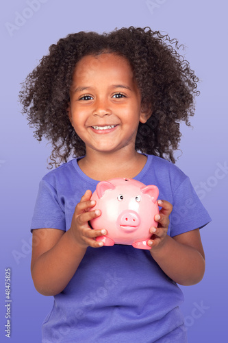 Photo: Adorable african little girl with piggy-bank Adorable african little girl with piggy-bank