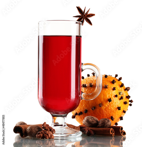 Photo: mulled wine in the glass, spice and orange isolated on white mulled wine in the glass, spice and orange isolated on white