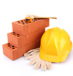 helmet, roulette, bricks and gloves isolated on white