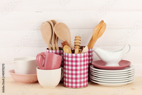 Photo: Cups, bowls nd other utensils in metal containers isolated Cups, bowls nd other utensils in metal containers isolated