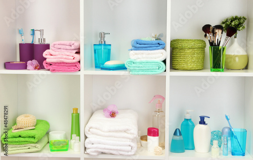 Photo: Bath accessories on shelfs in bathroom Bath accessories on shelfs in bathroom